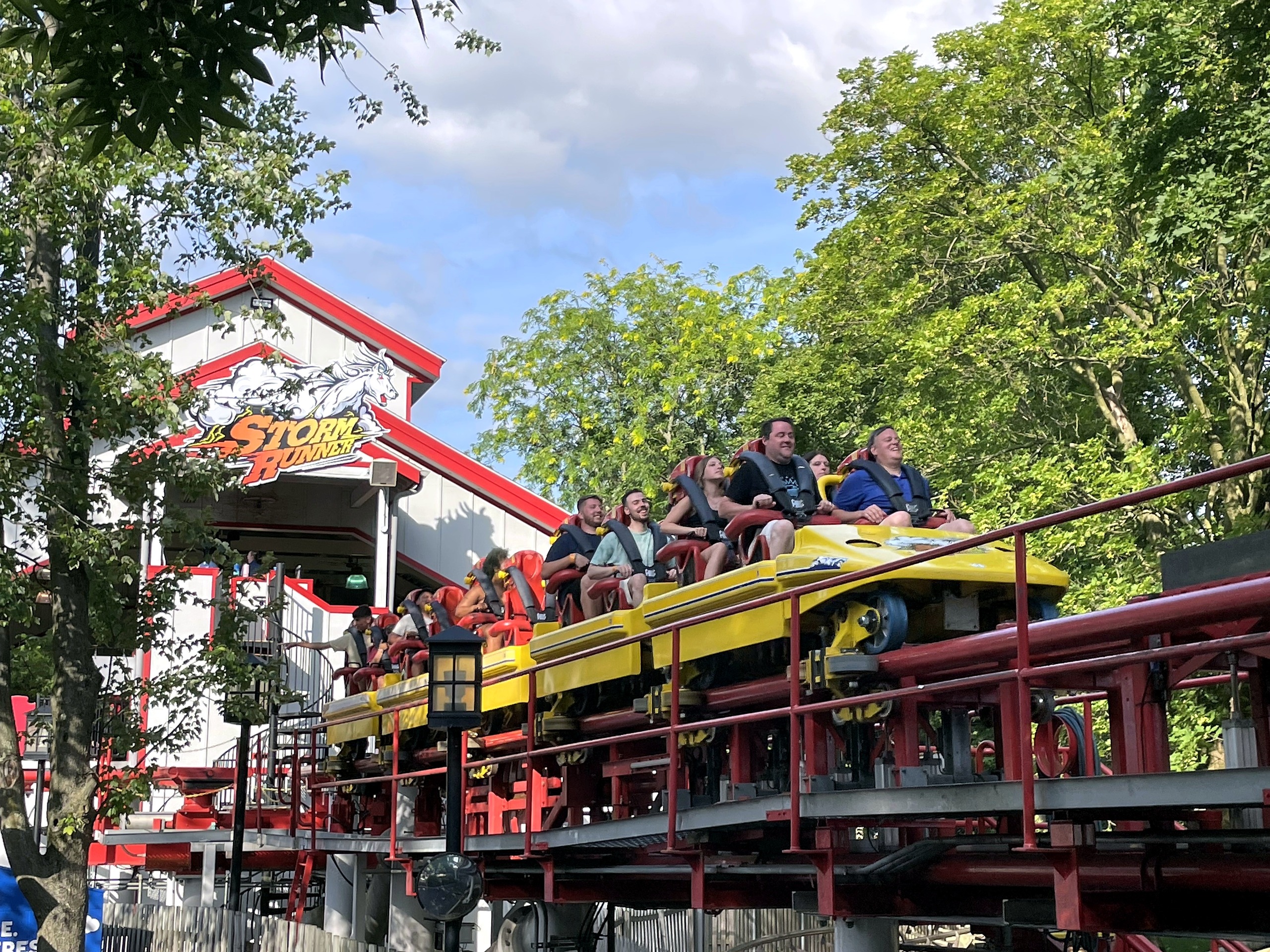 A Storm Runner train staged on the launch track with riders waiting at Hersheypark, June 2021