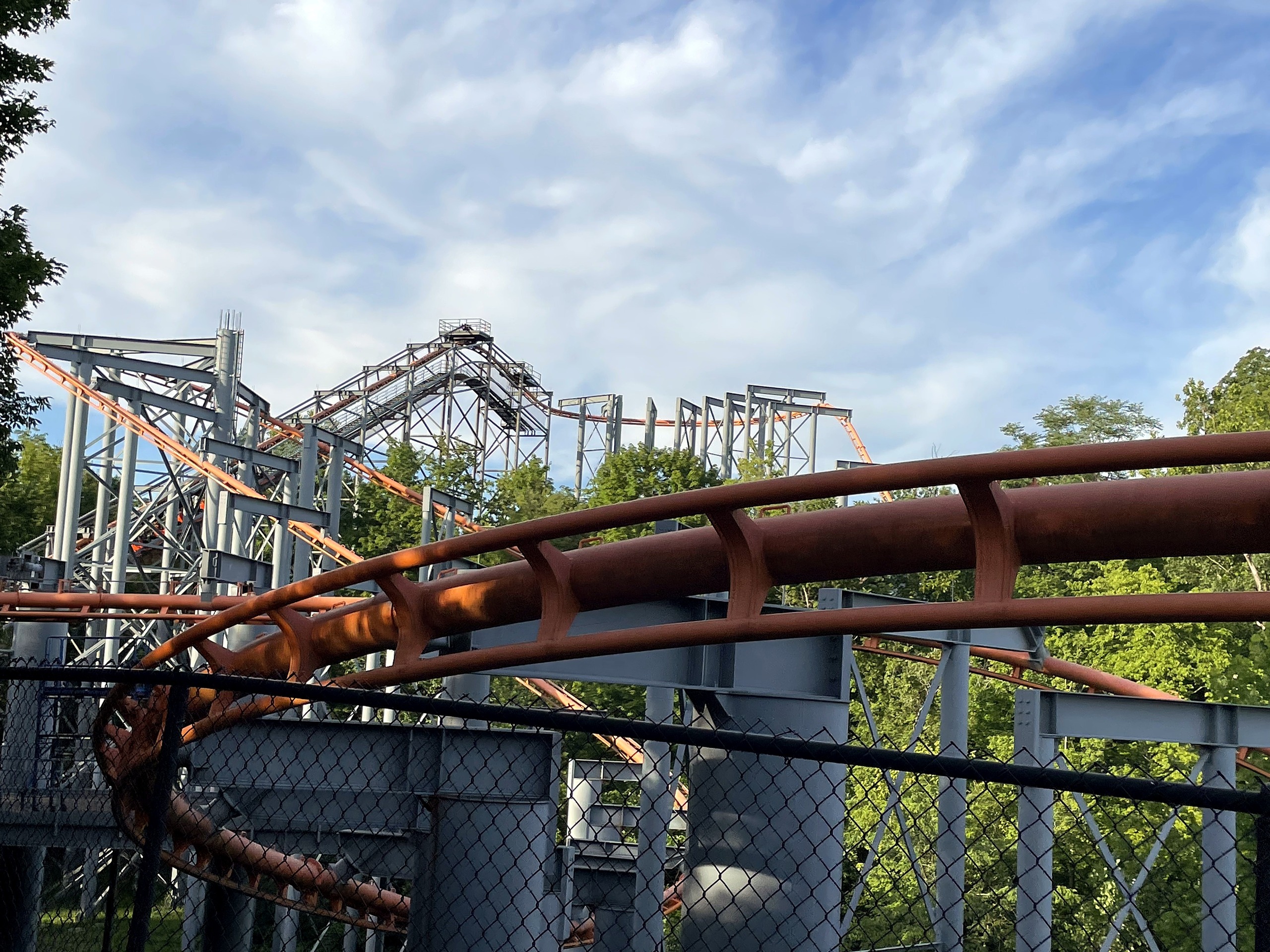 The Bat's orange track curving low through the trees, Kings Island, July 2022
