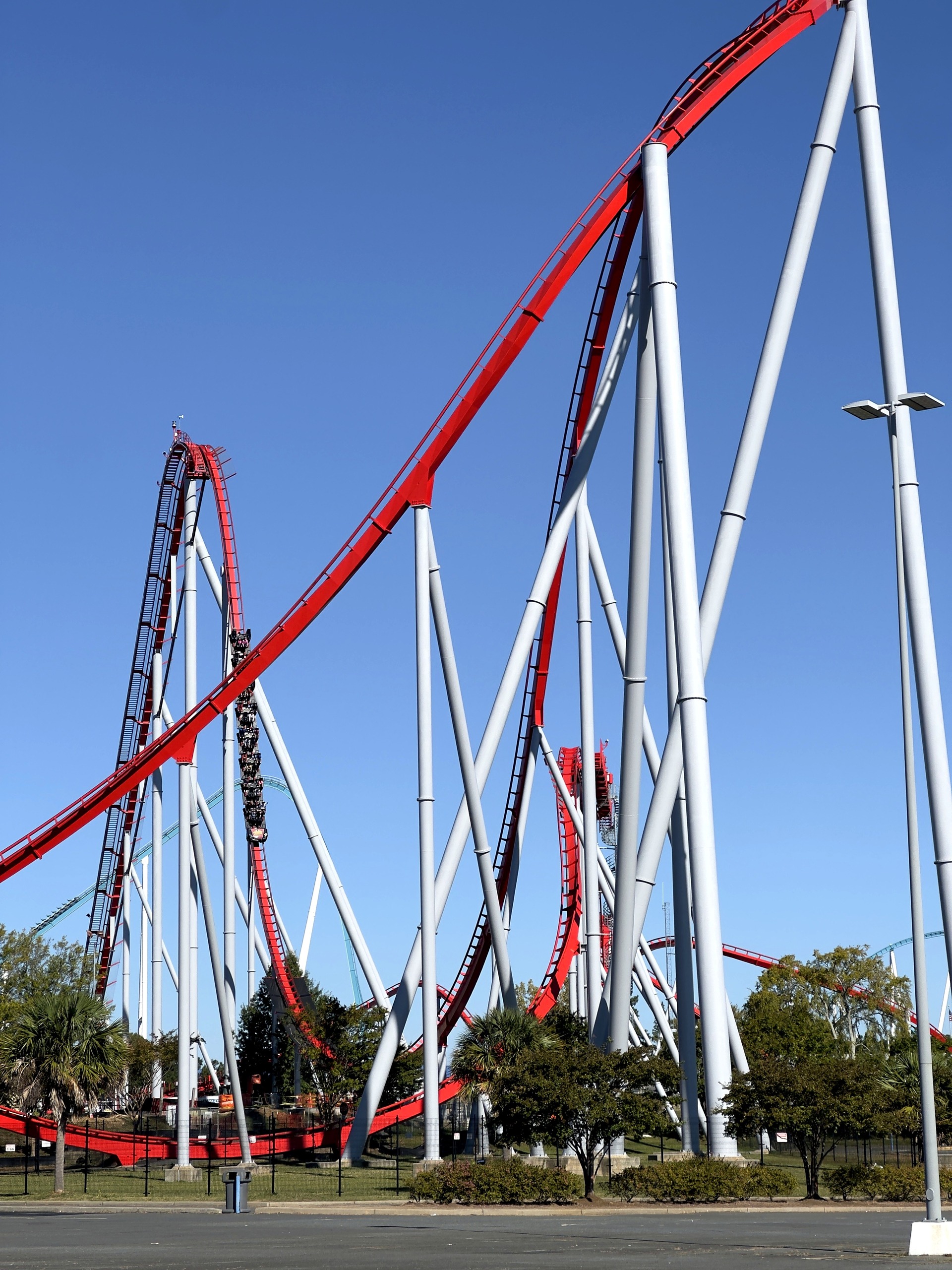 A Thunder Striker train on the 211-foot first drop at Carowinds, October 2024