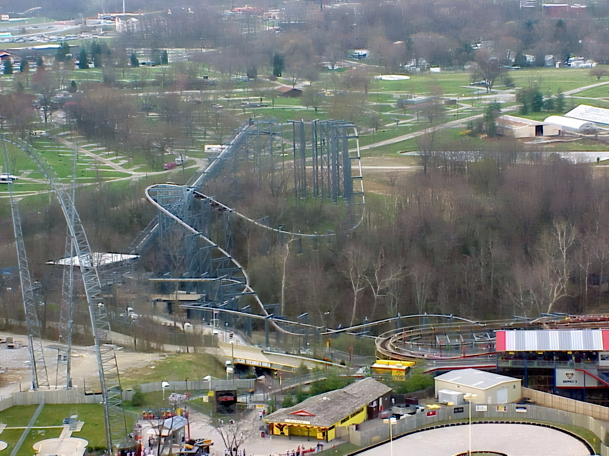 Top Gun's track winding into the woods, seen from the Eiffel Tower at Paramount's Kings Island, April 2001