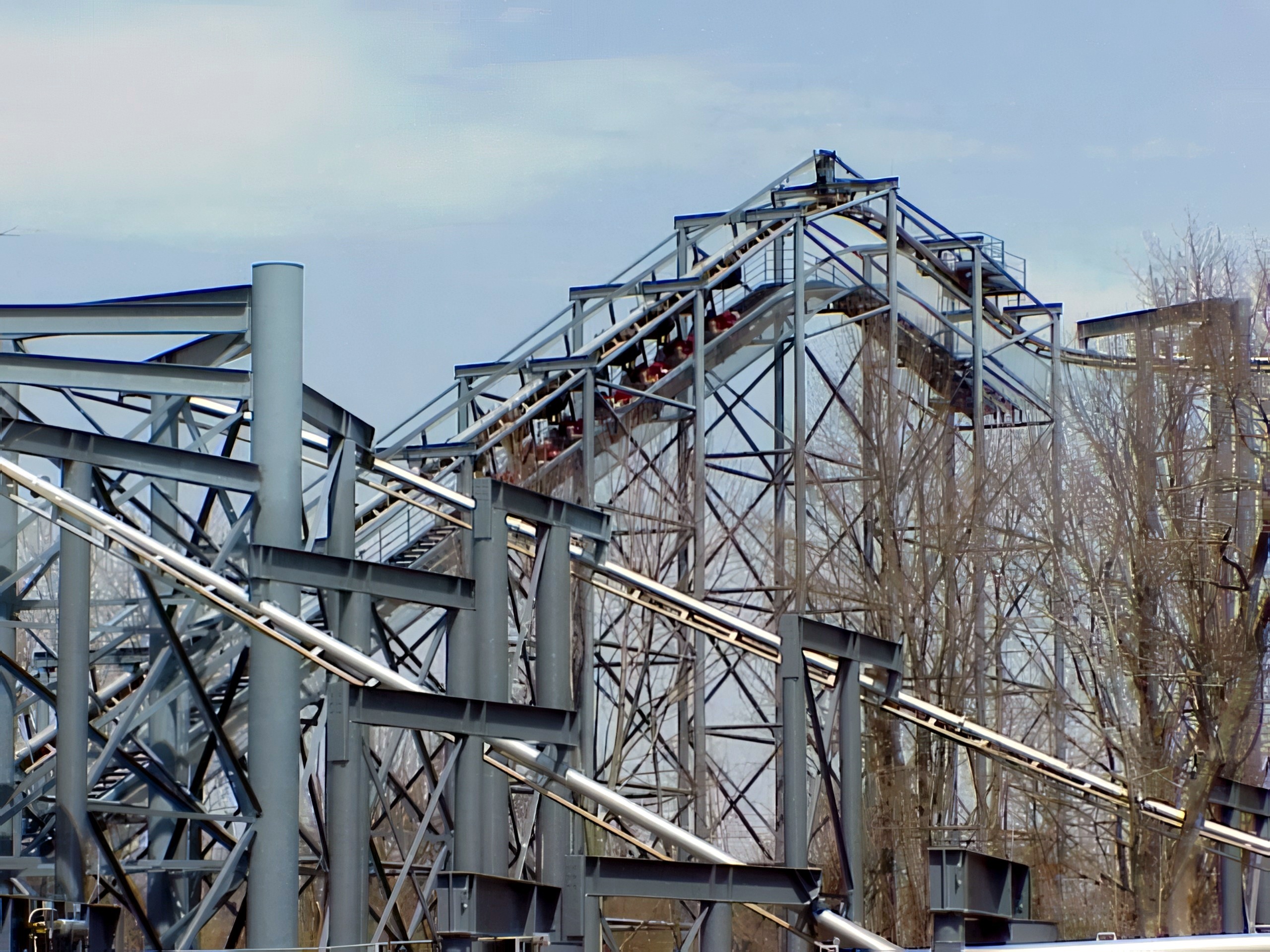 A Top Gun train climbing the lift between the gray supports at Paramount's Kings Island, April 2001