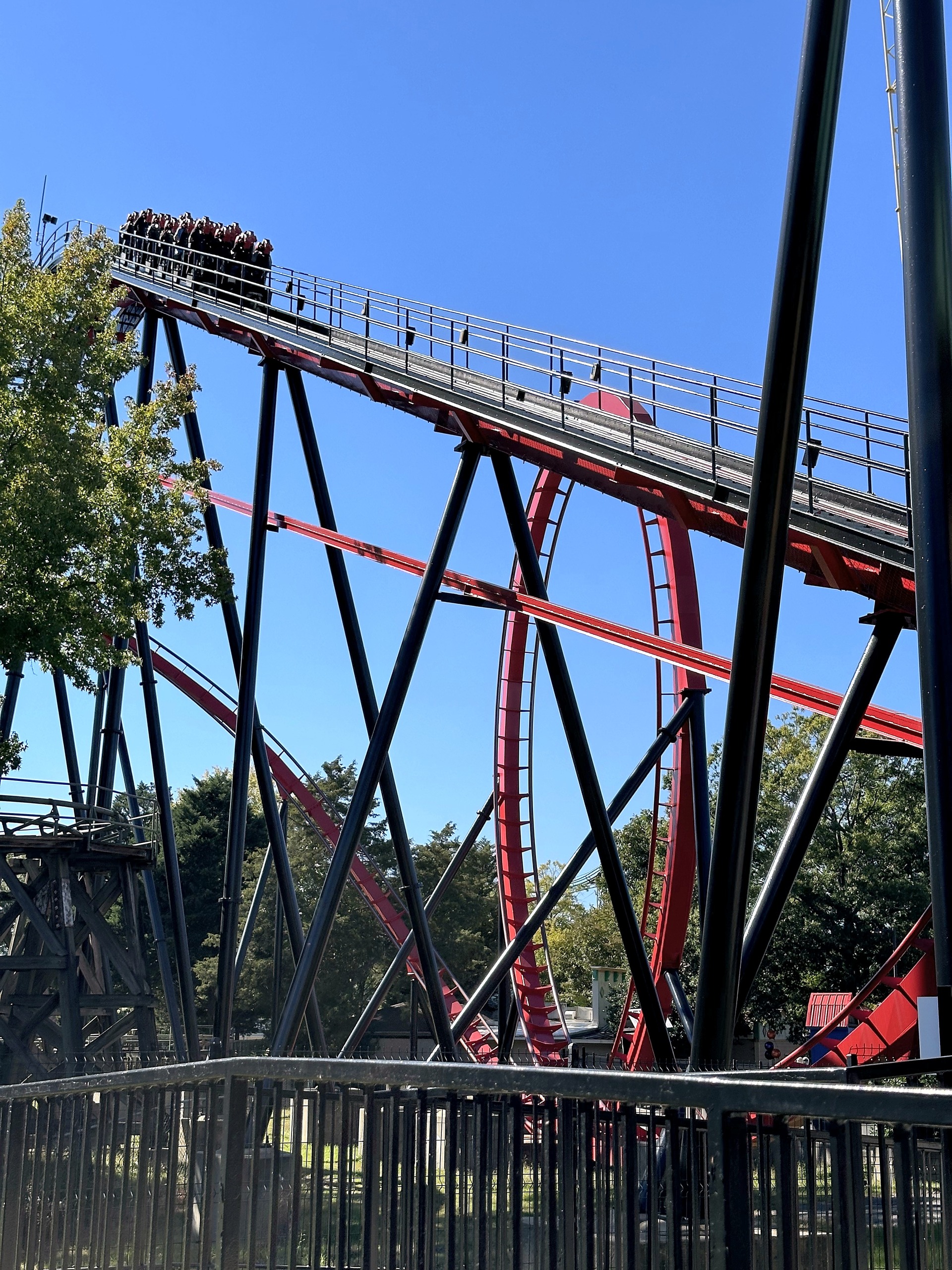 A Vortex train at the top of the lift hill at Carowinds, October 2024