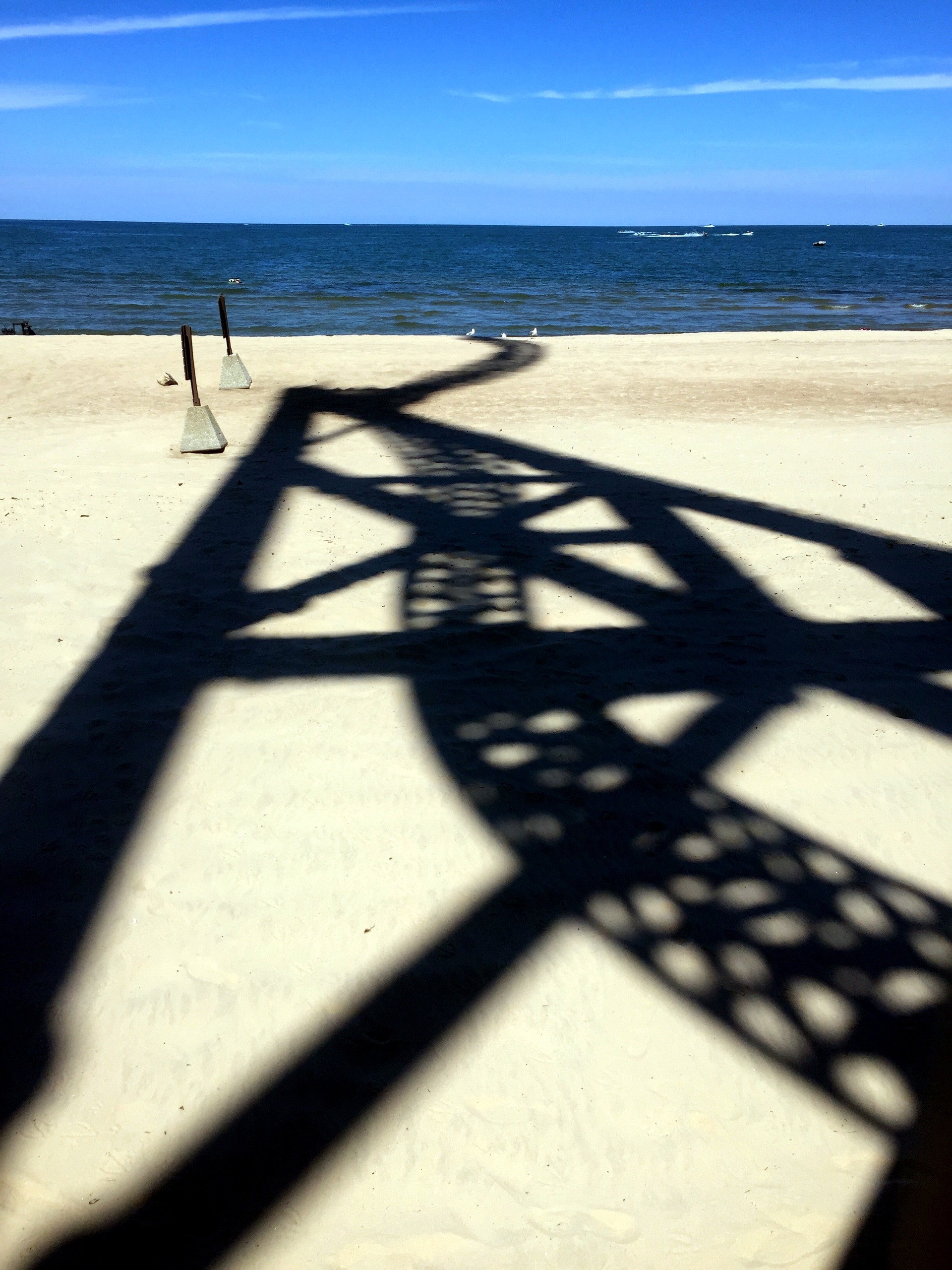 The shadow of Wicked Twister stretching across the beach beside Lake Erie at Cedar Point, July 2016